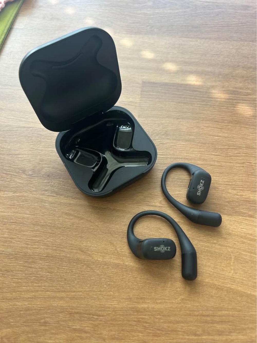 Shokz Openfit black over the ear sport earbuds with charging case